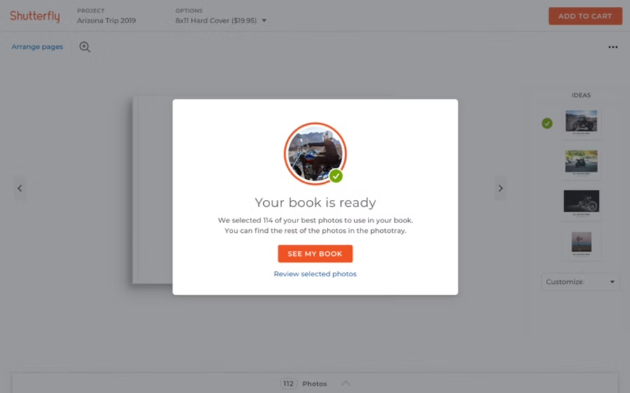 A dialog reading: Your book is ready. We selected 114 of your best photos to use in your book.